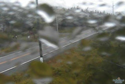 An image showing raindrops on a camera lens